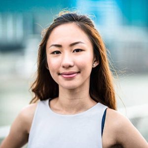 pretty asian woman standing outdoors